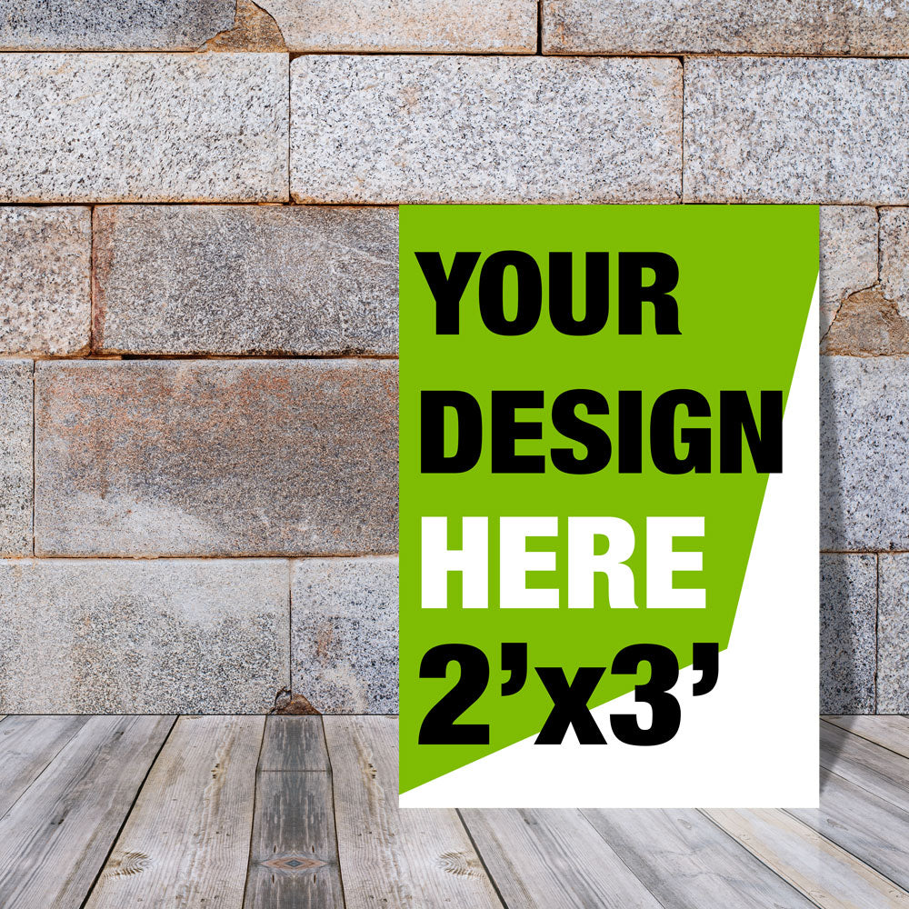 Placeholder foam core sign with text 'Your design here 2'x3'' against a stone wall background.