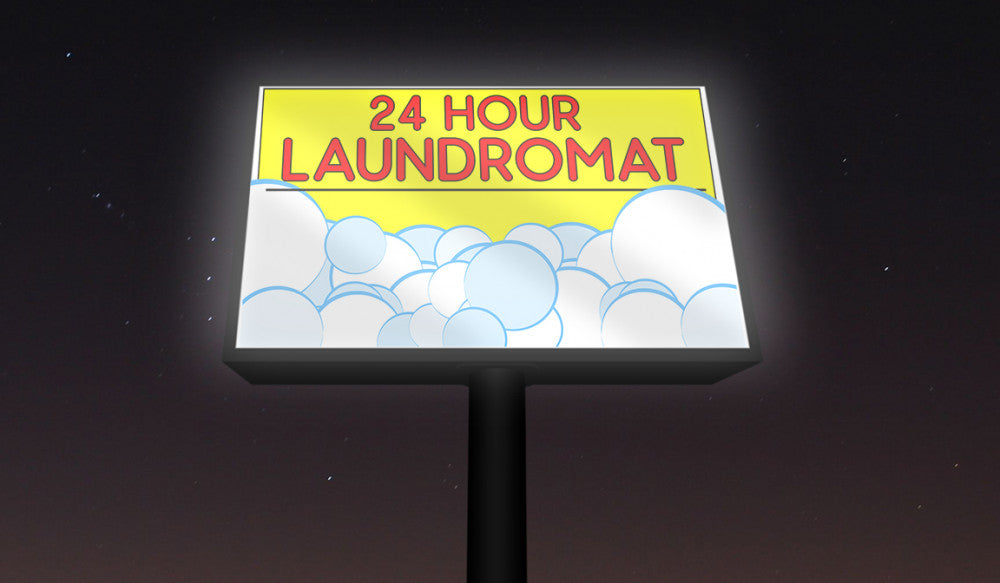 Illuminated outdoor 24 hour laundromat backlit vinyl banner signboard with yellow and pink typography by 760 Print.