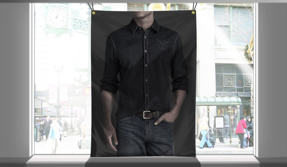 Custom 9.5oz blockout fabric banner with brass grommets hanging in a retail storefront window display.