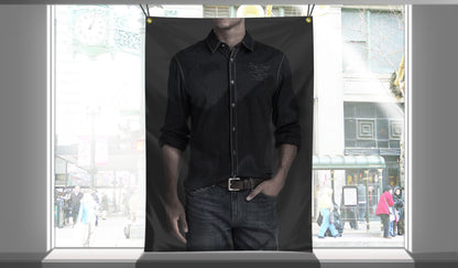 Custom 9.5oz blockout fabric banner with brass grommets hanging in a retail storefront window display.