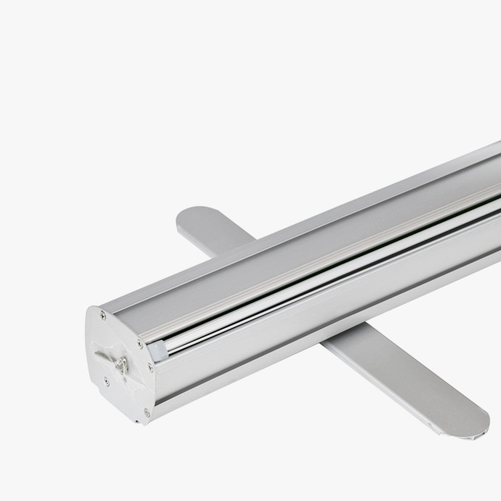 Close-up of a silver aluminum retractable banner stand base with banner returned into the base, available at 760 Print in Vista.