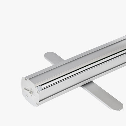 Close-up of a silver aluminum retractable banner stand base with banner returned into the base, available at 760 Print in Vista.