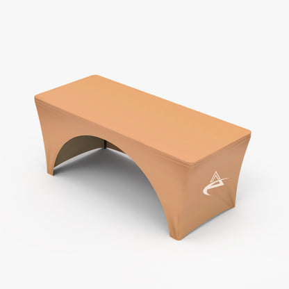 Custom printed peach and coral 3-sided open-back stretch table cover featuring a side panel corporate logo, produced by 760 Print in Vista.