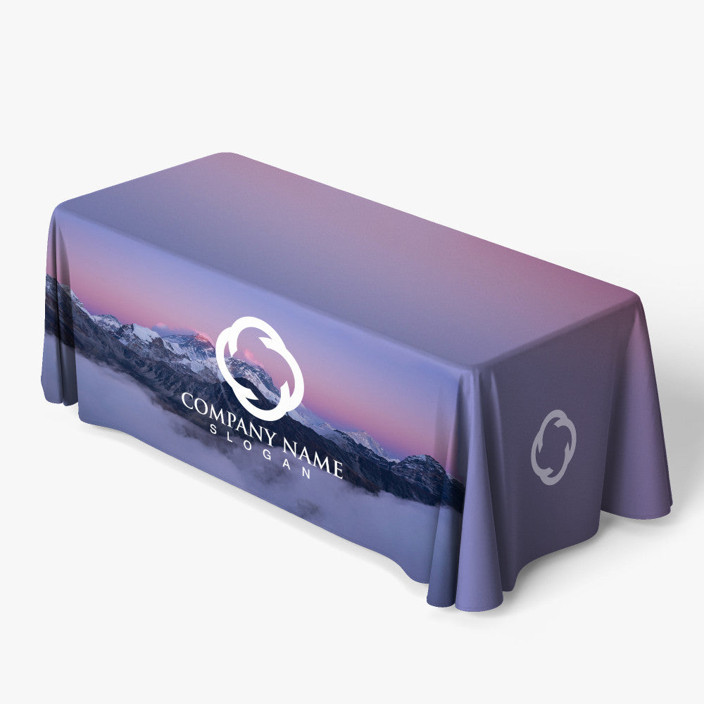 Custom printed 6ft fitted table cover featuring a full-bleed forest mountain design and a white corporate logo on the front panel, produced by 760 Print in Vista.