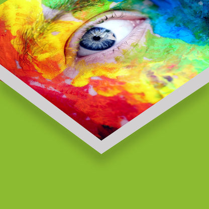An acrylic sign featuring a close-up of a colorful eye with vibrant splashes of red, blue, and yellow around it, highlighting the print quality and the durable, clear edges of the acrylic material.