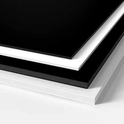 Black and white GatorFoam sheets stacked on each other and manufactured by 760 Print in Vista. 