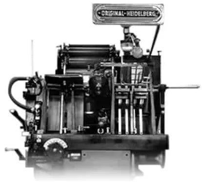 Heidelberg Original Heidelberg Windmill letterpress printing press used in commercial print shops for die cutting, embossing, scoring, and traditional letterpress printing with heavy-duty mechanical operation.