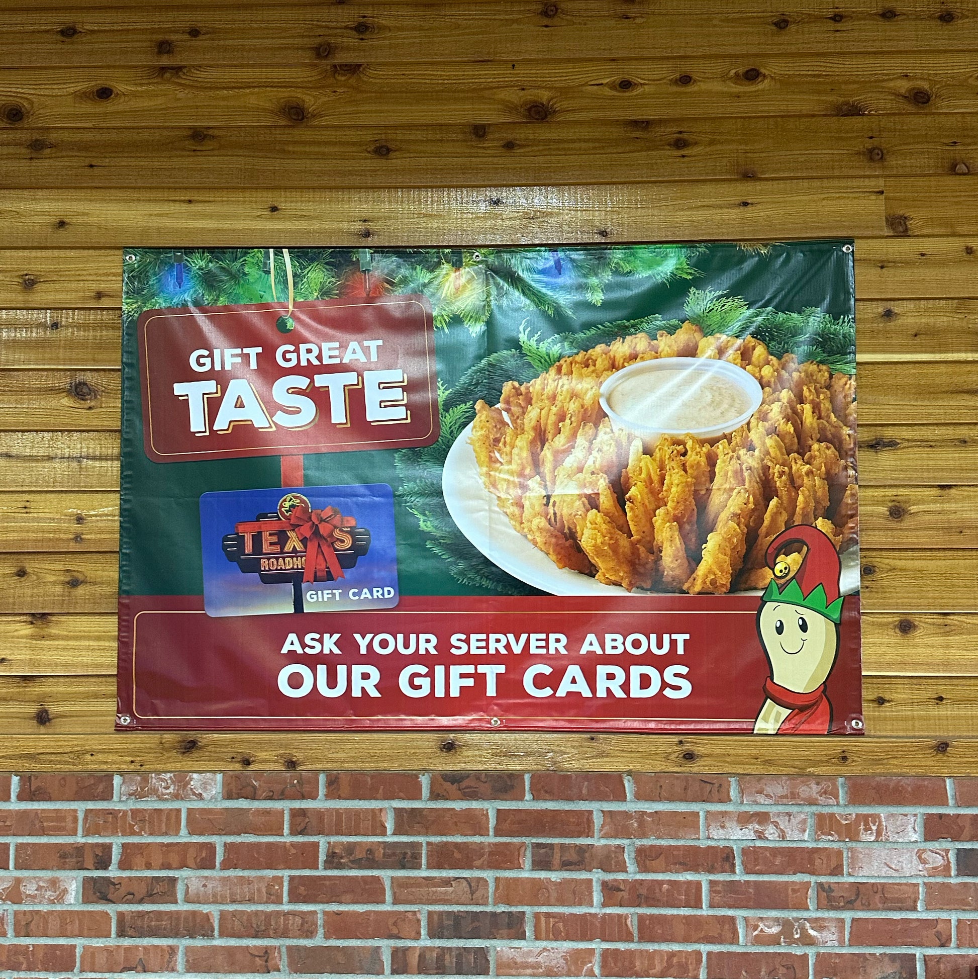 A four by eight foot banner printed for Texas Roadhouse's promotional gift card deal and enticing blooming onion. 